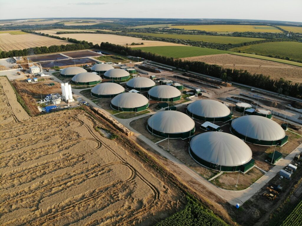 Modern bio comlex. Renewable energy from biomass. Innovative biogas plant among green nature.