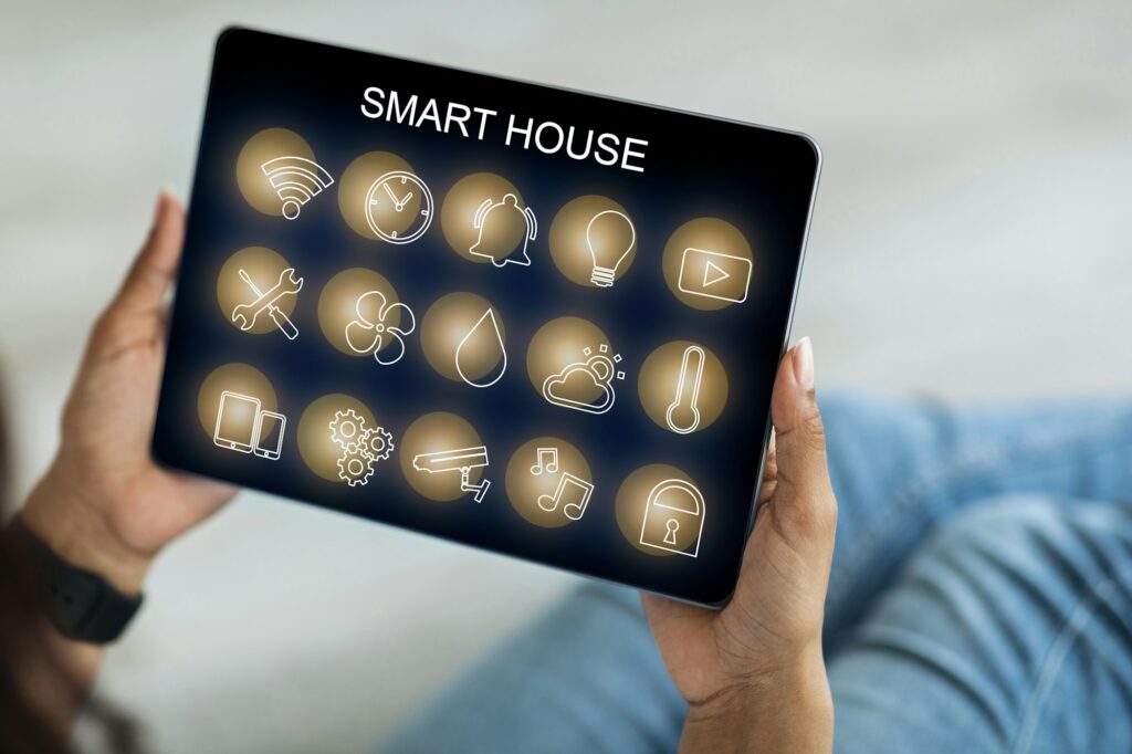 Smart house panel in black woman hands, closeup